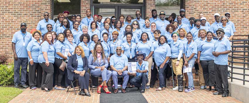 Columbia Housing Staff Together in front of Office Entrance